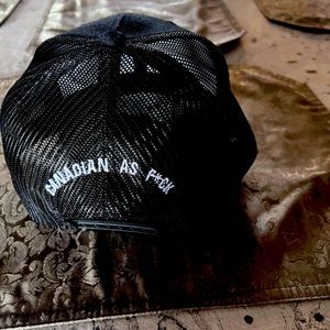 Authentic Yupoong SnapBack hat—Black.